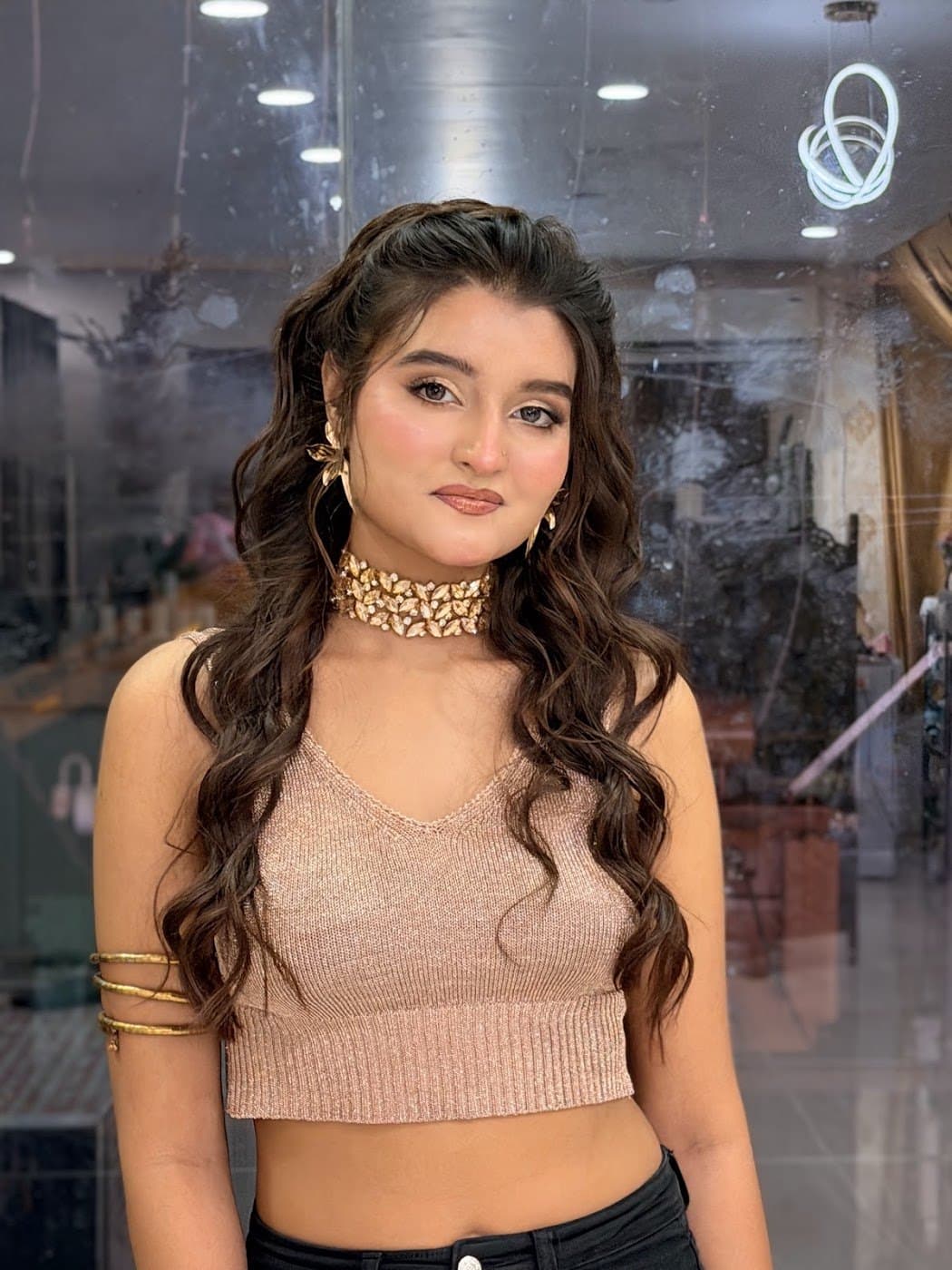 Party makeup with bronze glam and voluminous curls